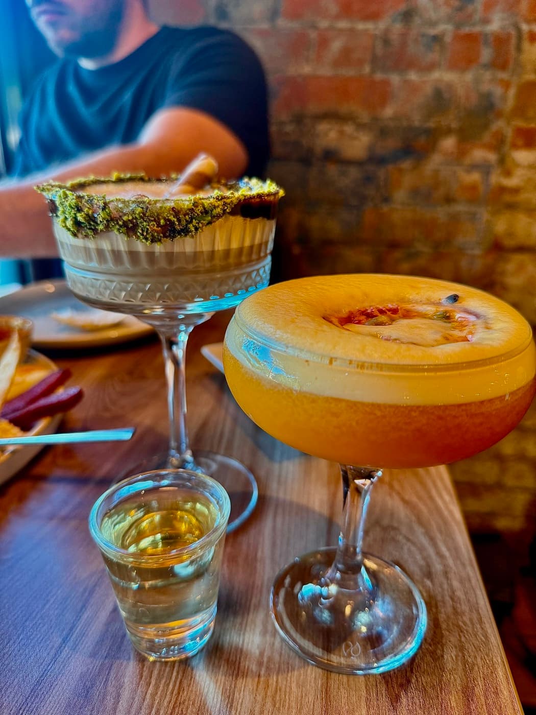 A Dubai Chocolate Baileys with a pistachio-crusted rim and a Pornstar Martini topped with passion fruit at Antep Kitchen Oxford
