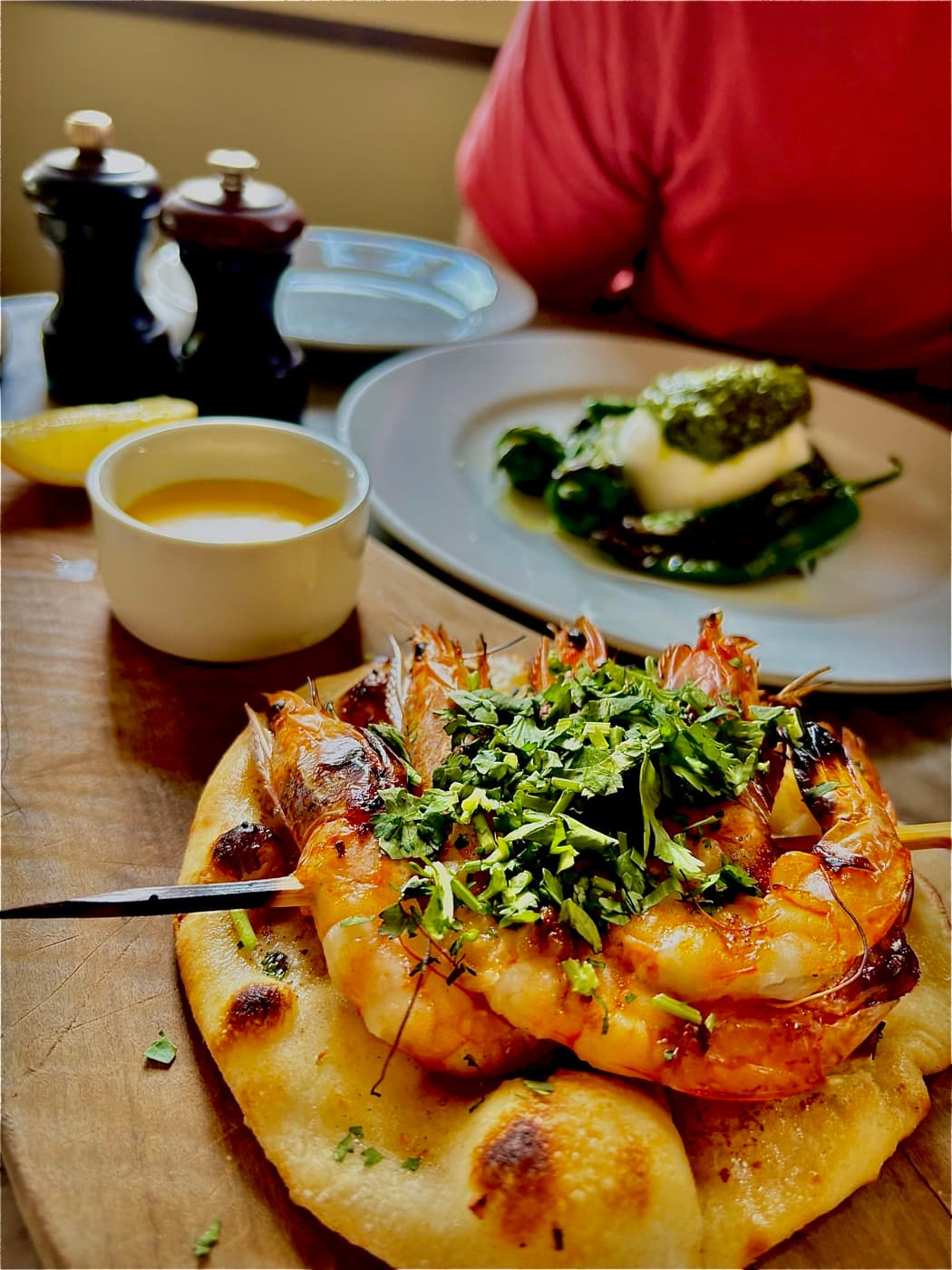 Grilled king prawn skewer on garlic butter flatbread at Branca
