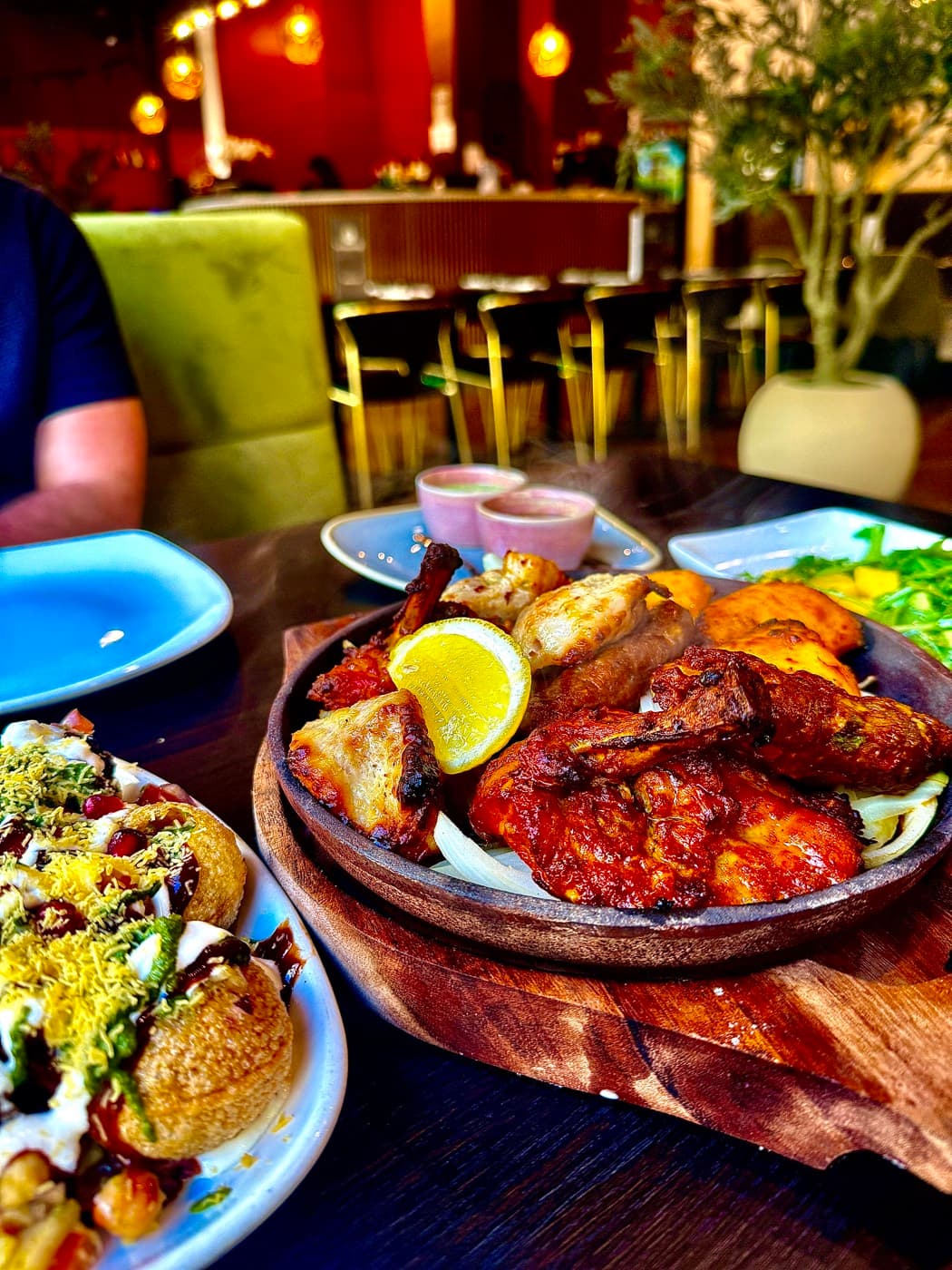 The Tempering Grand Sizzler mixed grill arriving at the table on a sizzling board
