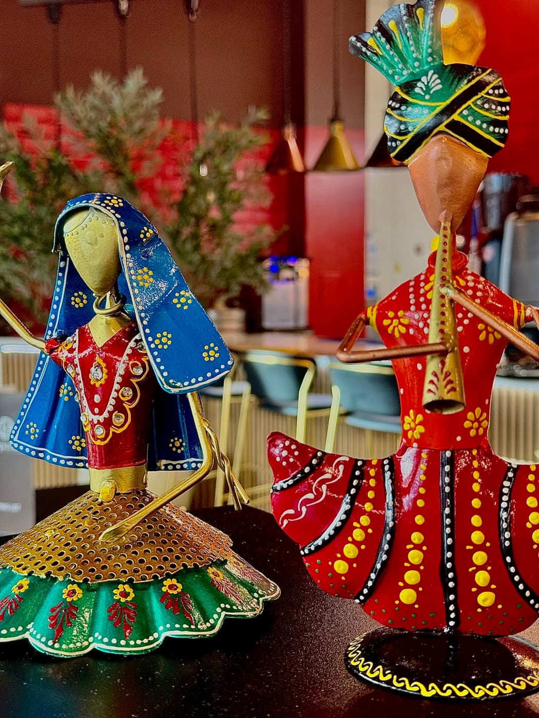 Hand-painted Indian figurine ornaments on display at Tempering